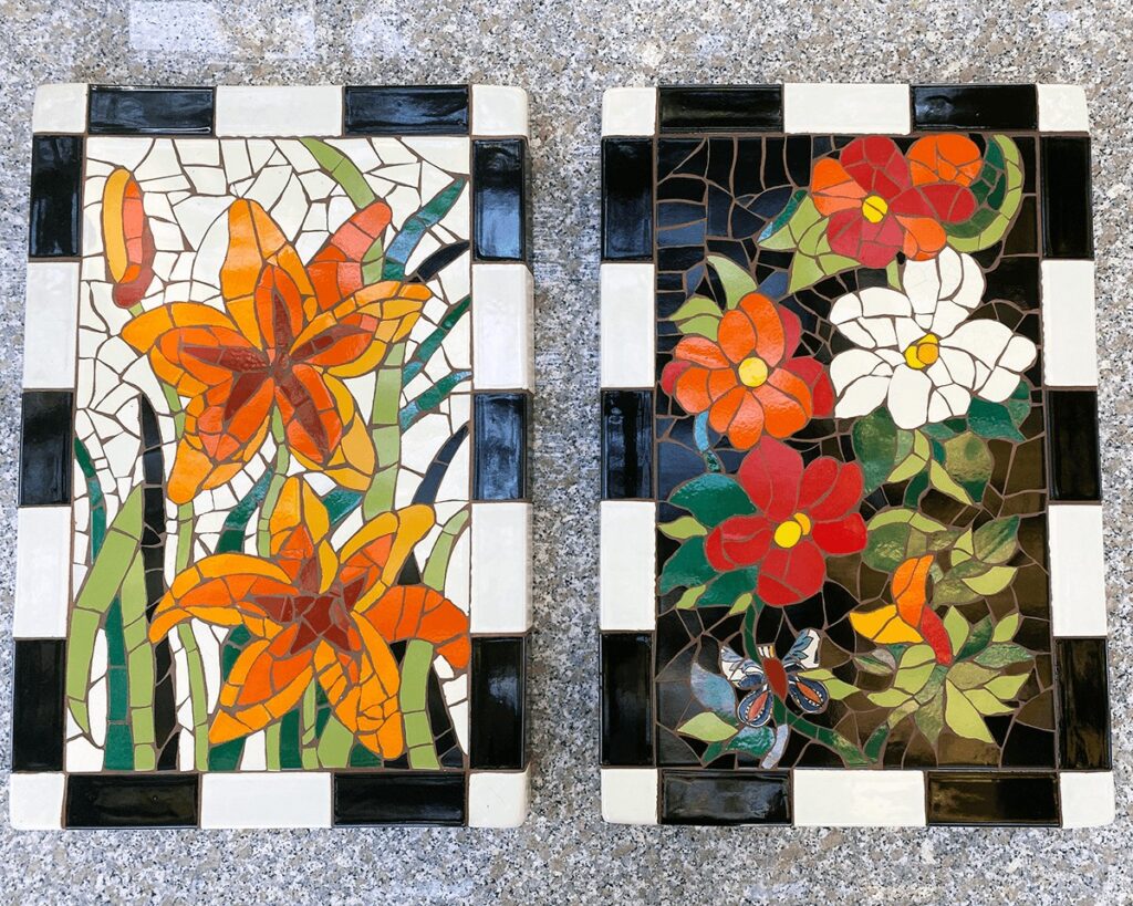two trencadis broken tile mosaic tabletops that are grouted and ready to be mounted to a concrete base