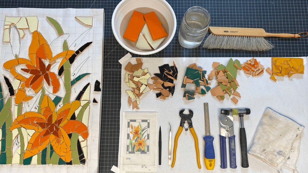 supplies and tools used for creating a broken tile mosaic tabletop